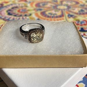 Lia Sophia Cocktail ring. Gold and silver coloring with a yellow stone.